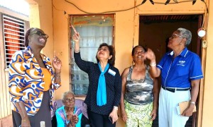 CCRP Reps sharing a moment at the handover of a repaired roof