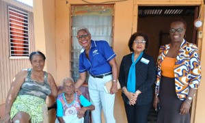 Recipient of a repaired roof donated by CCRP- Mavis Baggo and daughter